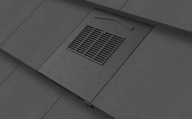 Grey flat edge tile ventilator installed onto grey tile roof