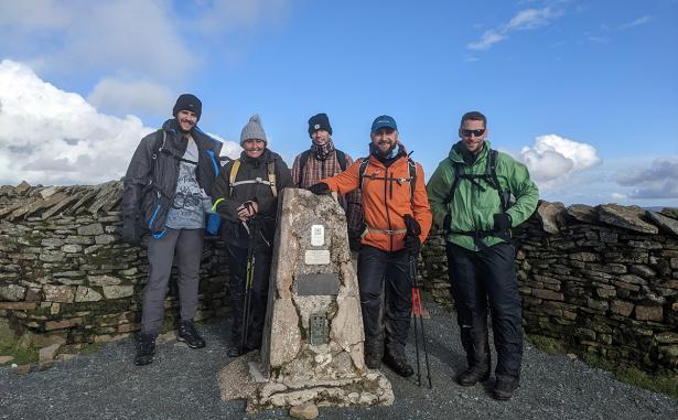 Team Manthorpe at the summit of a peak